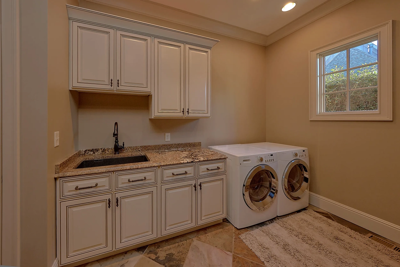 Laundry Room with Vanity and Cabinets